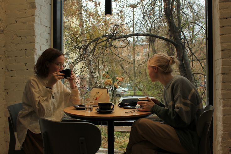 Two friends chatting over coffee.
